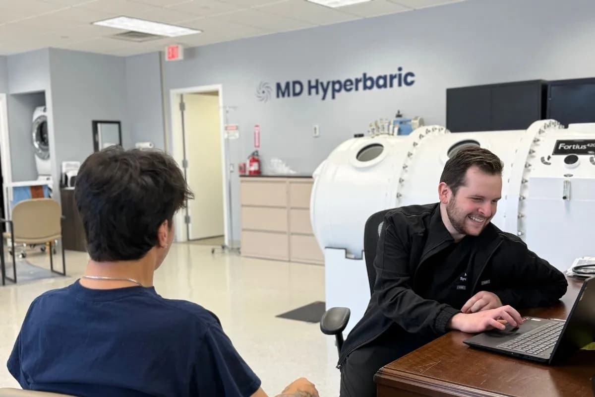 Patient being checked in beside an MD Hyperbaric chamber