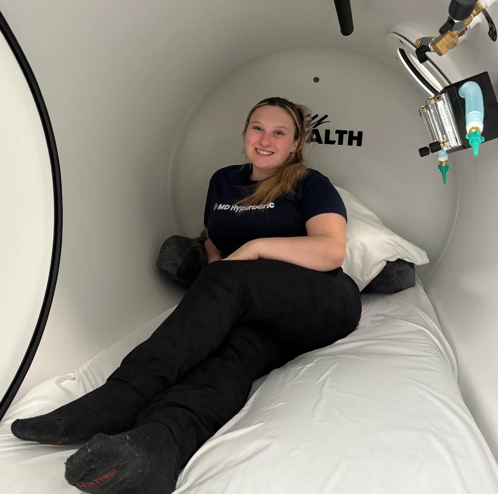 Patient resting inside an MD Hyperbaric chamber