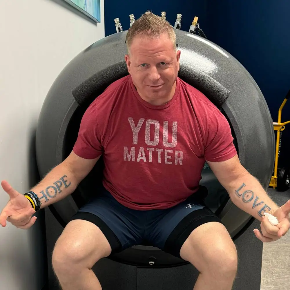 Strong patient in front of hyperbaric oxygen chamber